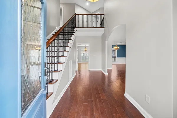 a view of a room with wooden floor and fireplace
