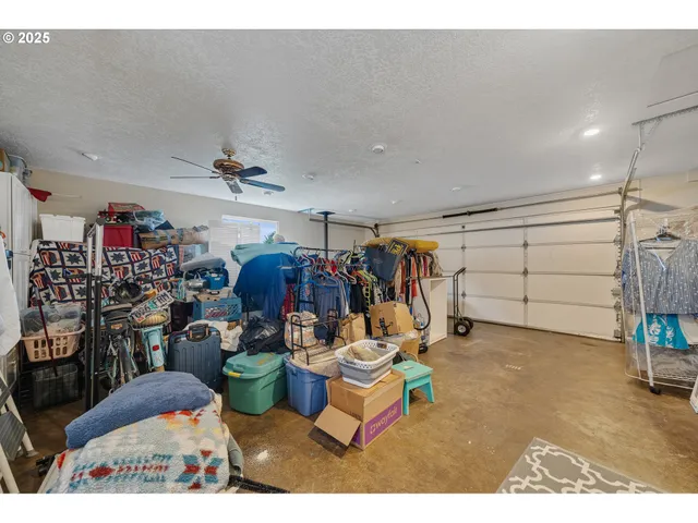 a kitchen with stainless steel appliances granite countertop a refrigerator and a stove
