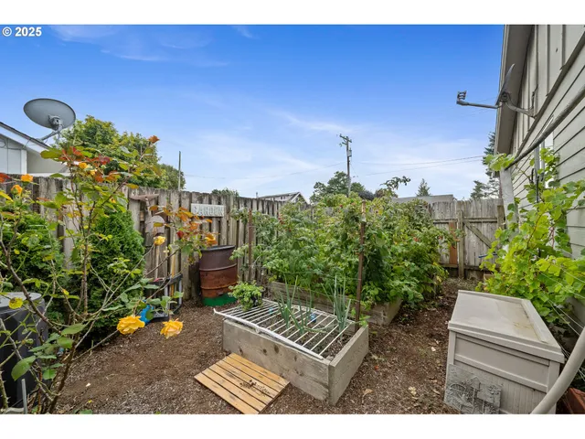 a view of a backyard with sitting area
