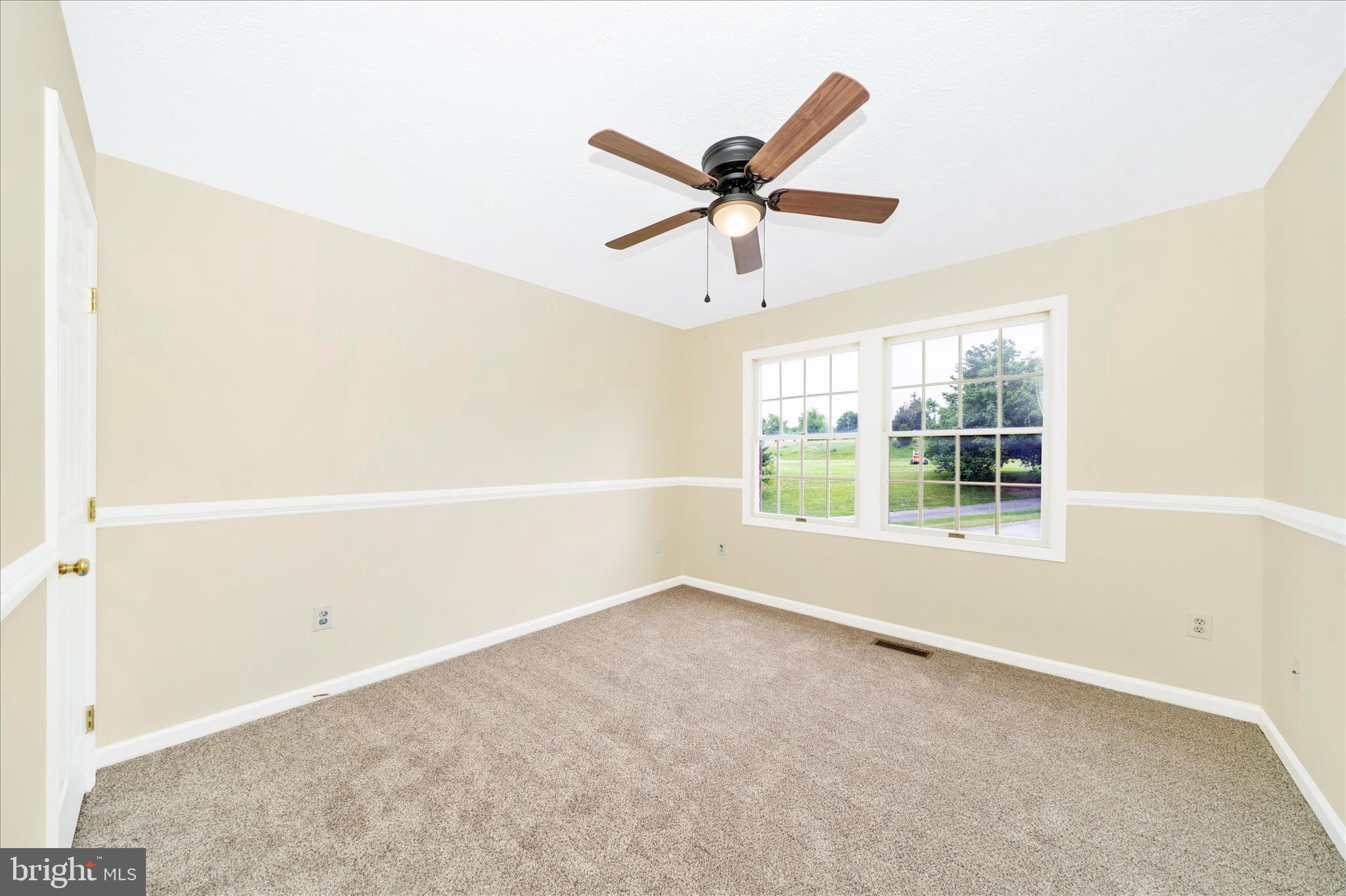 9534 Liberty Road Frederick, MD 21701 - Photo 38 of 70 a view of a big room with wooden floor and windows