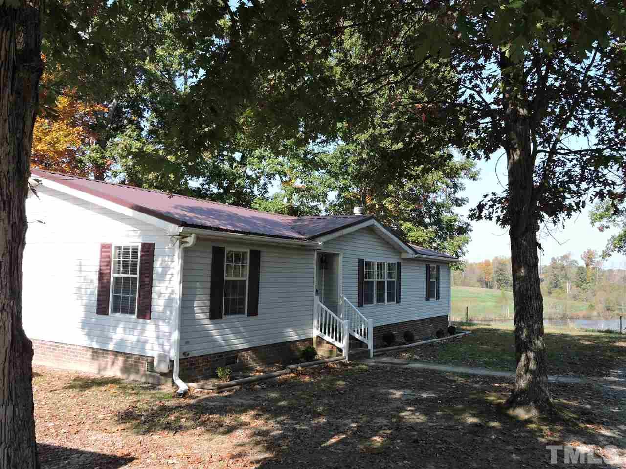 225 Bowling Road Roxboro, NC 27574 - Photo 1 of 19 a view of a house with a yard