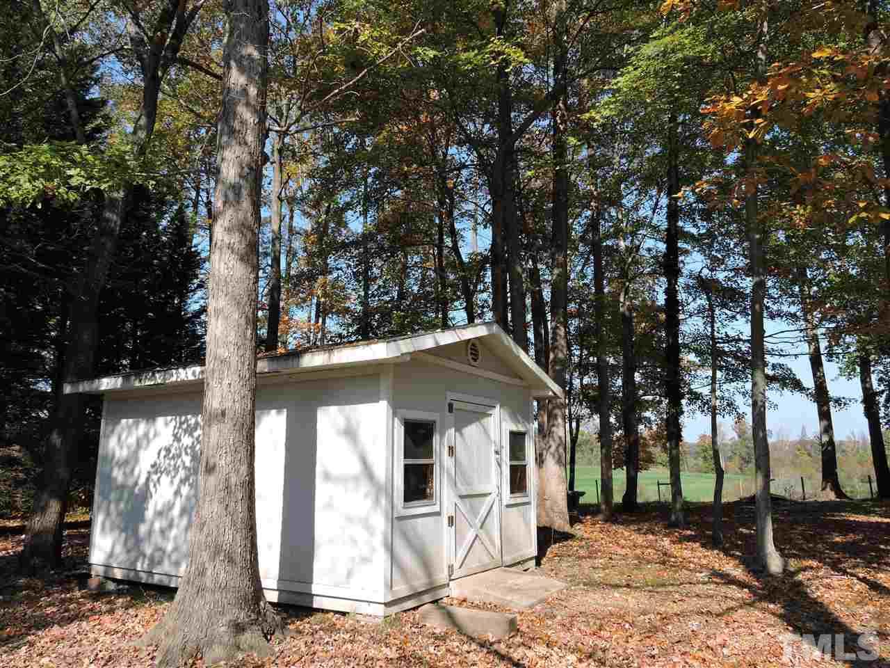 225 Bowling Road Roxboro, NC 27574 - Photo 13 of 19 a front view of a house with a tree