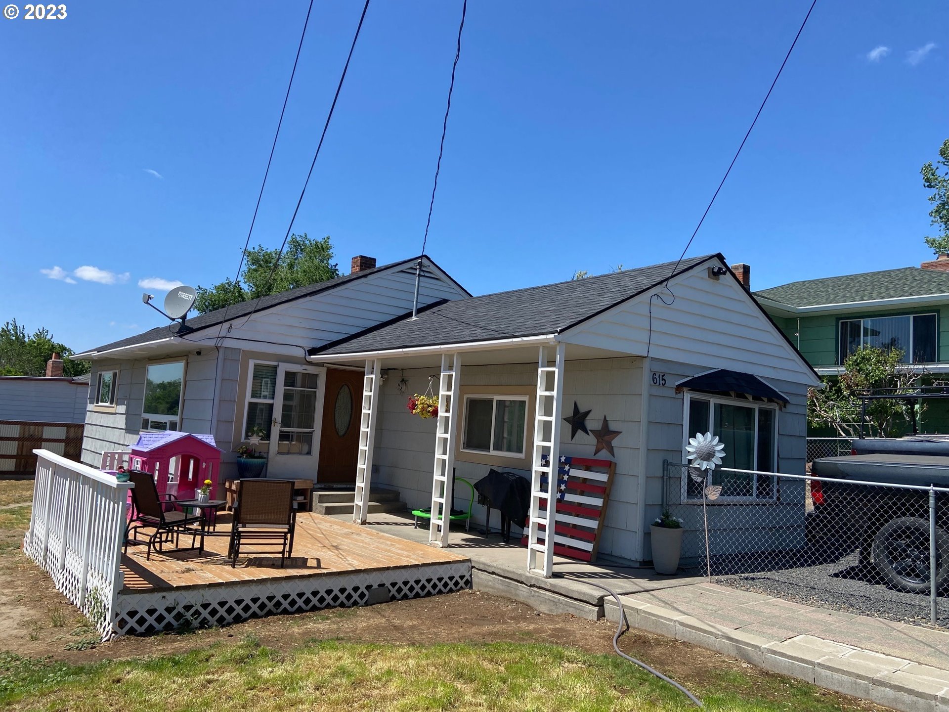 a front view of house with yard patio and livingroom view