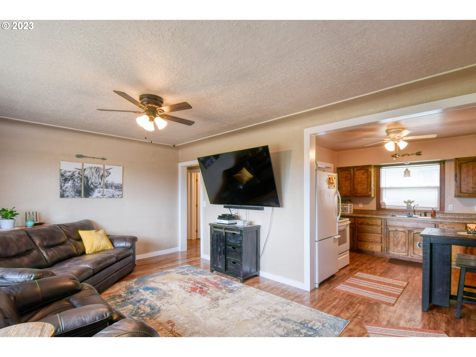 615 Northwest 5th Street Pendleton, OR 97801 - Photo 11 of 33 a living room with furniture and a flat screen tv
