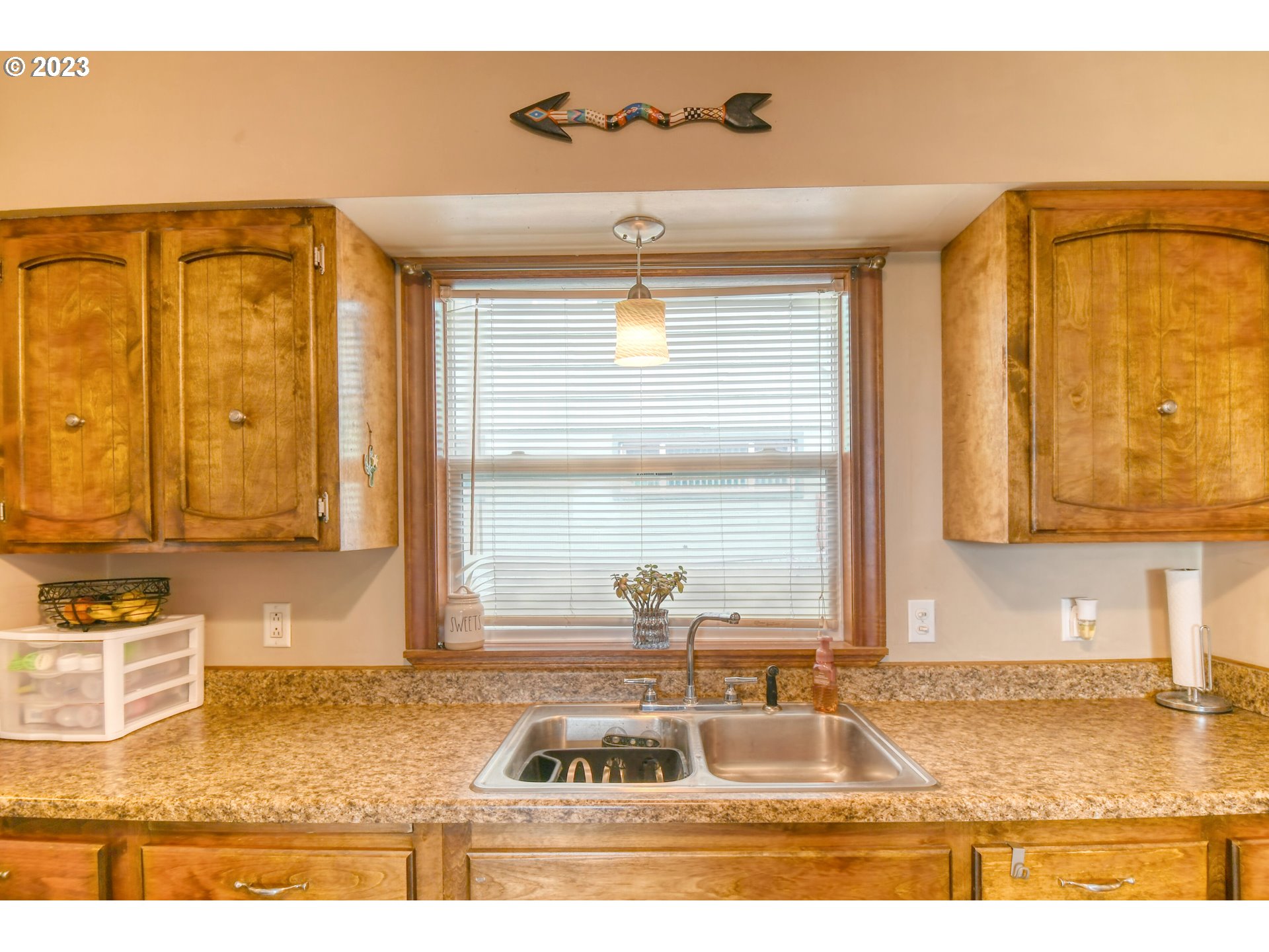 615 Northwest 5th Street Pendleton, OR 97801 - Photo 15 of 33 a view of a kitchen with kitchen island a sink and a window