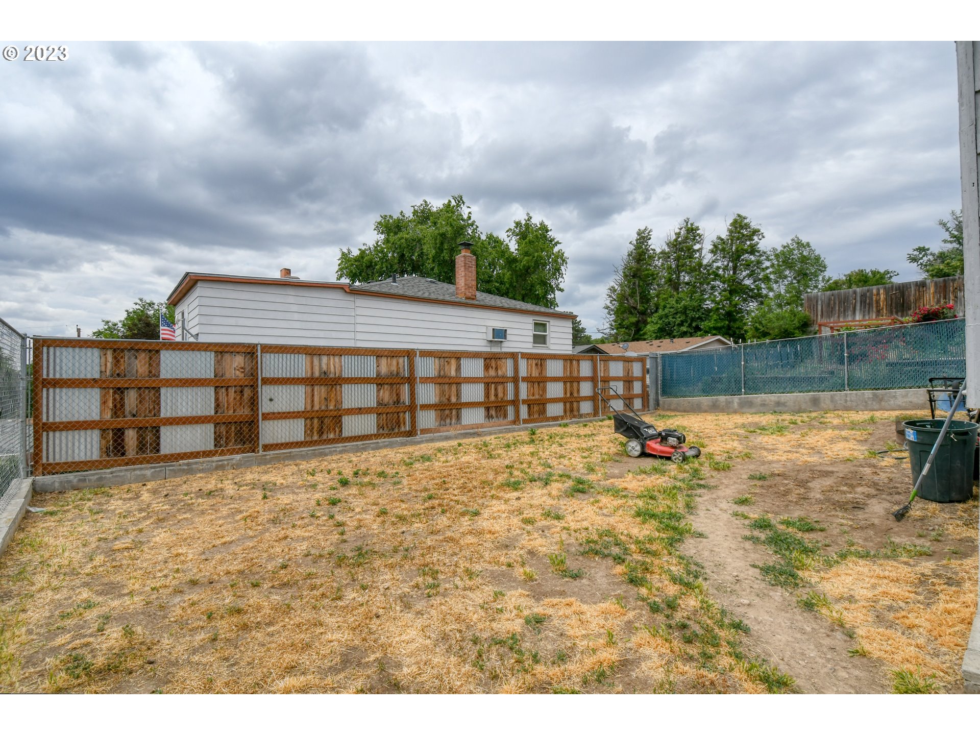 615 Northwest 5th Street Pendleton, OR 97801 - Photo 33 of 33 a view of swimming pool with lawn chairs and wooden fence