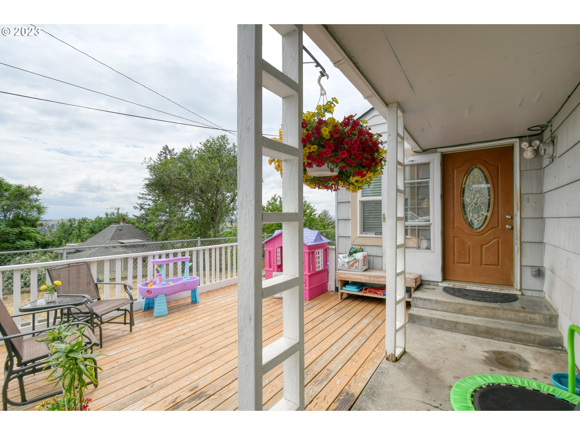 615 Northwest 5th Street Pendleton, OR 97801 - Photo 7 of 33 a balcony with wooden floor table and chairs