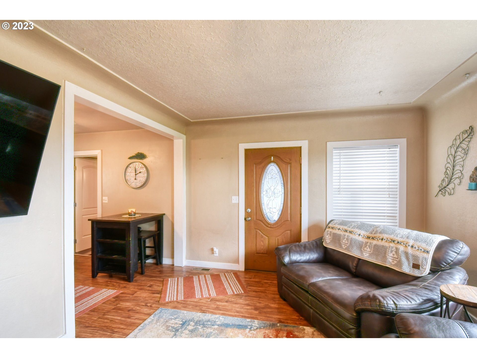 615 Northwest 5th Street Pendleton, OR 97801 - Photo 10 of 33 a living room with furniture and a flat screen tv