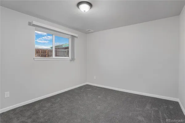 an empty room with a bathroom