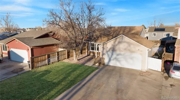 an aerial view of a house with a garden