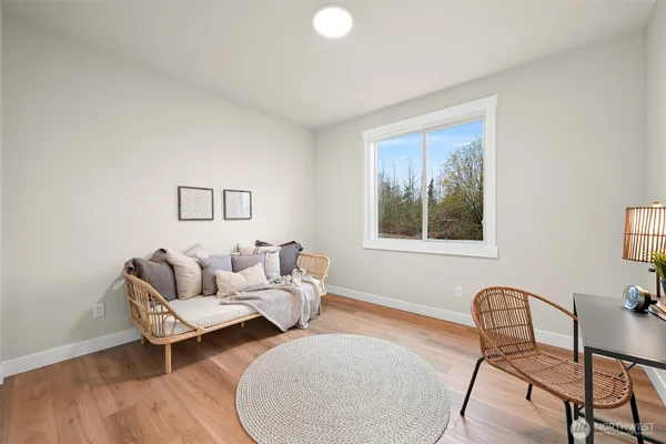 a living room with furniture and window