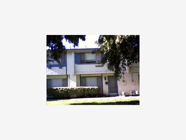 a living room with a couch and a fireplace