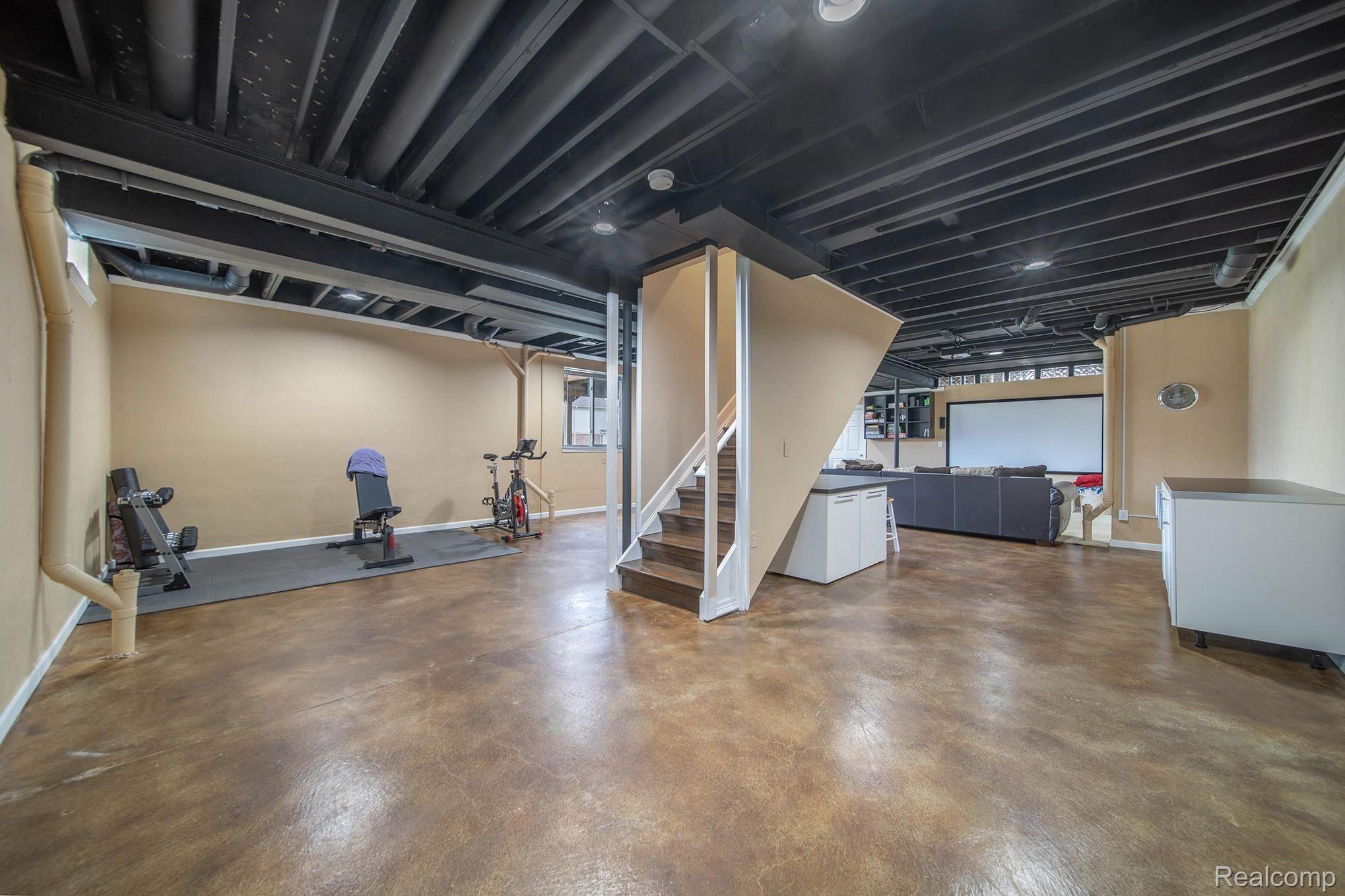 3438 Cascade Circle Rochester, MI 48307 - Photo 28 of 35 BASEMENT STAINED CONCRETE FLOOR - SLEEK CABINETRY