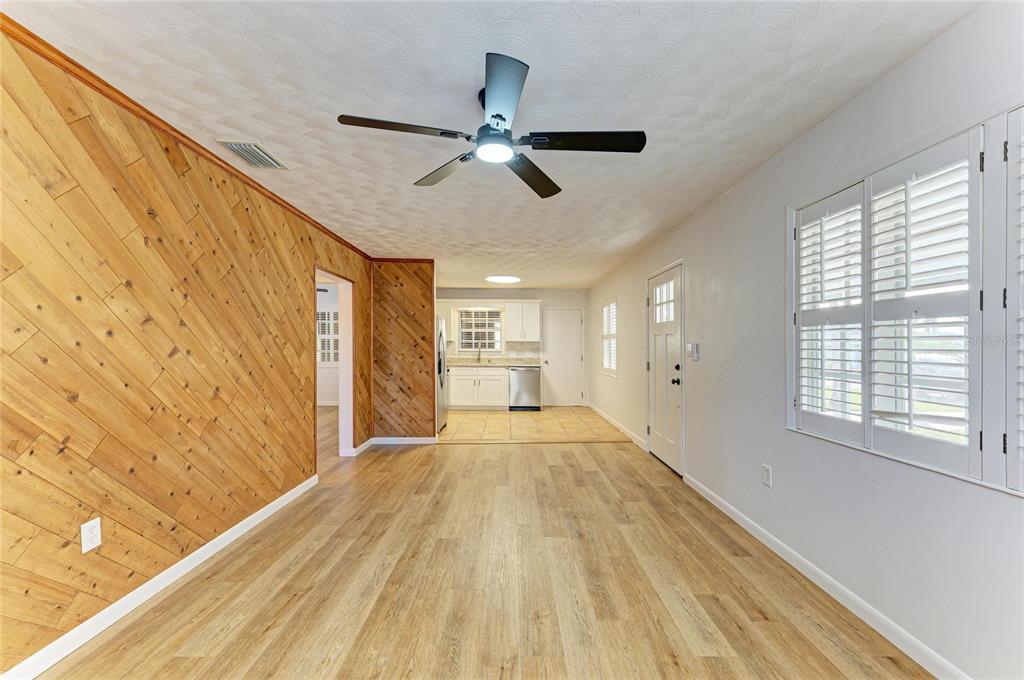 616 Palm Avenue Ellenton, FL 34222 - Photo 11 of 53 a view of empty room with wooden floor and fan
