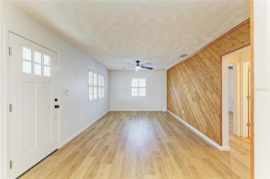 616 Palm Avenue Ellenton, FL 34222 - Photo 12 of 53 wooden floor in an empty room with a window