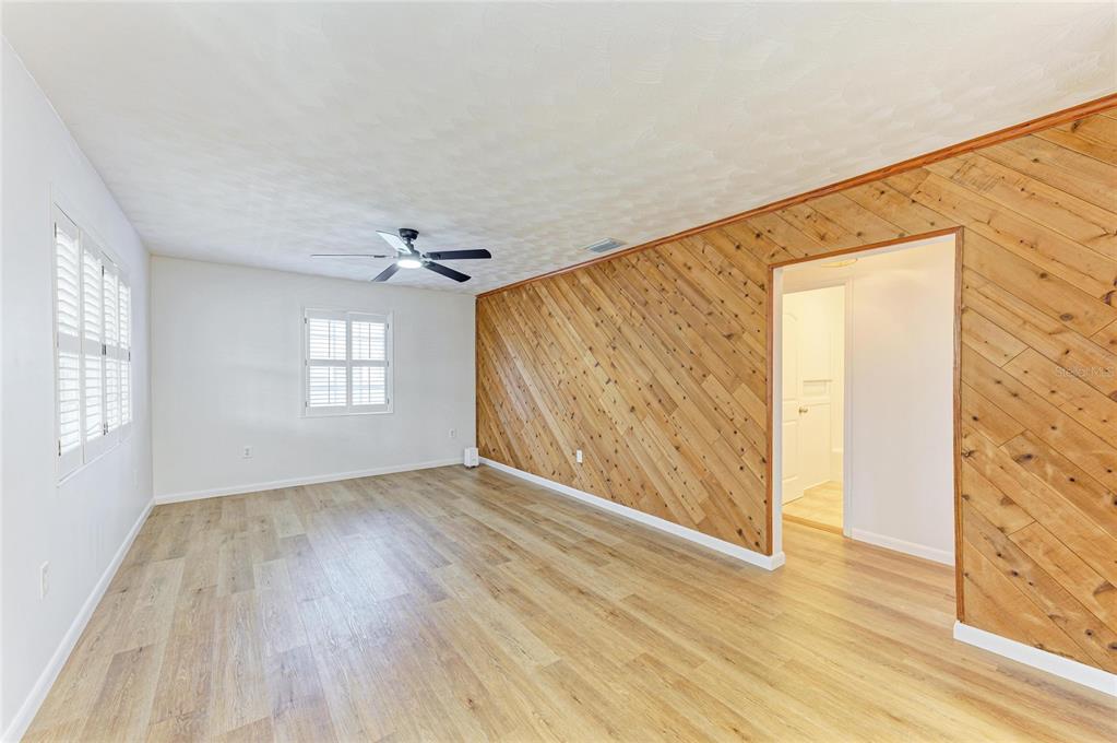 616 Palm Avenue Ellenton, FL 34222 - Photo 13 of 53 wooden floor in an empty room with a window