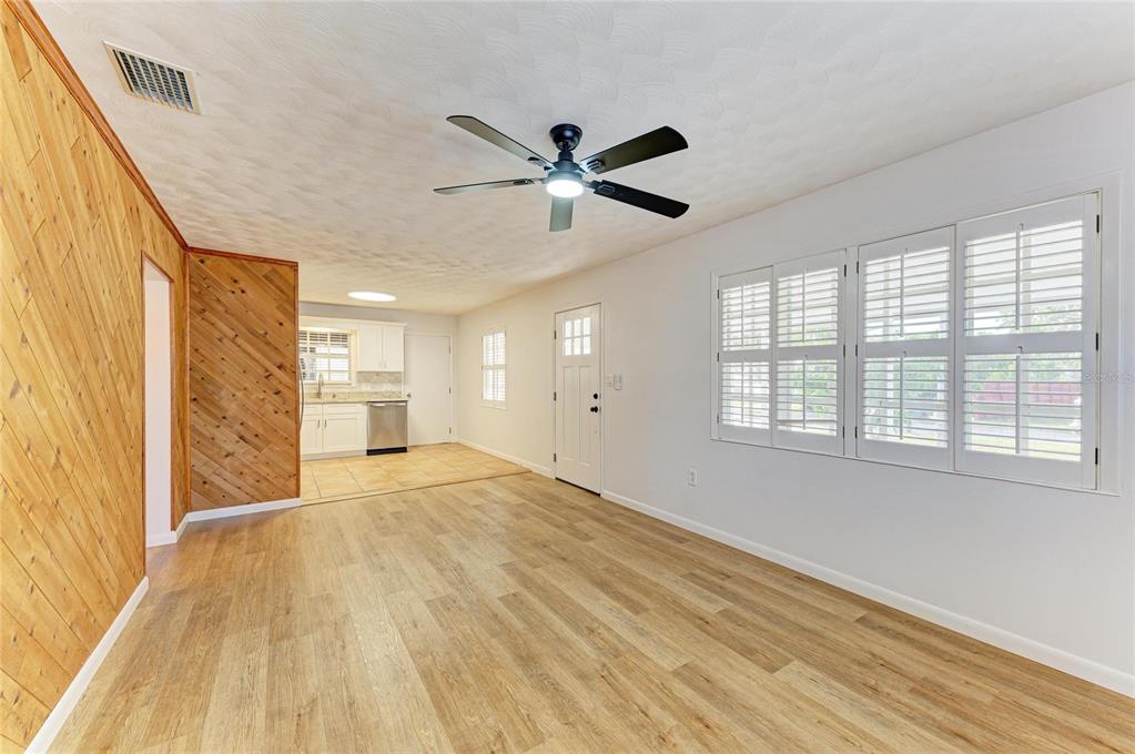 616 Palm Avenue Ellenton, FL 34222 - Photo 14 of 53 a view of empty room with wooden floor and fan