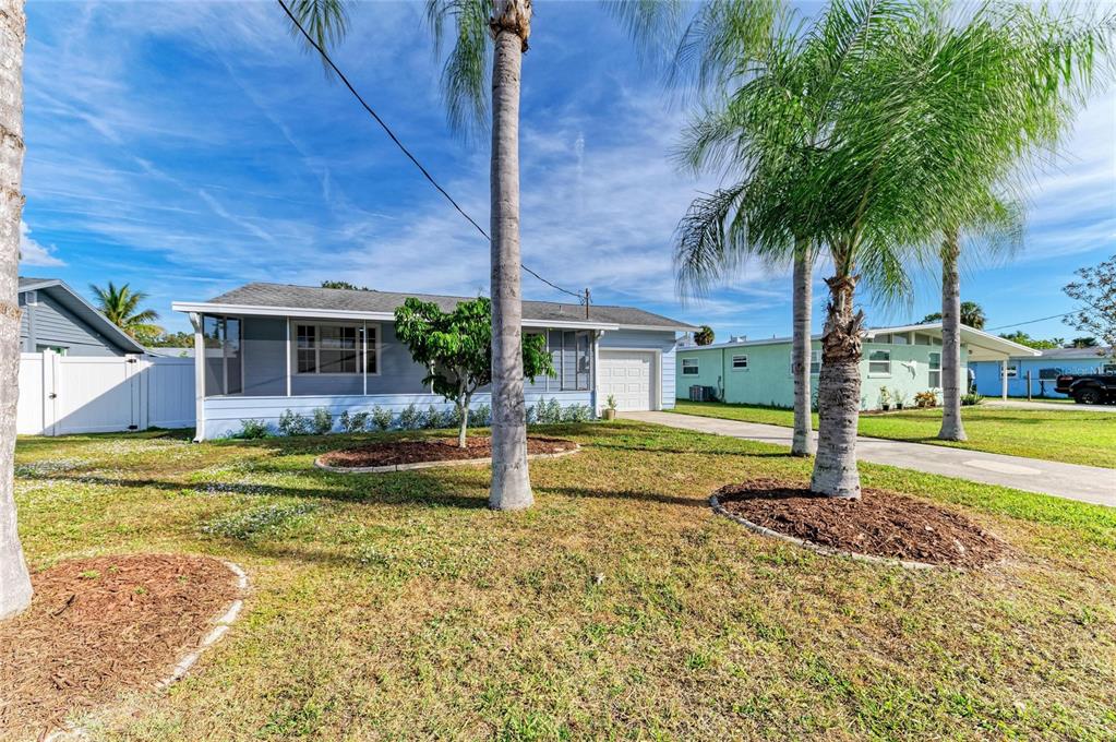 616 Palm Avenue Ellenton, FL 34222 - Photo 2 of 53 a house with swimming pool in front of it