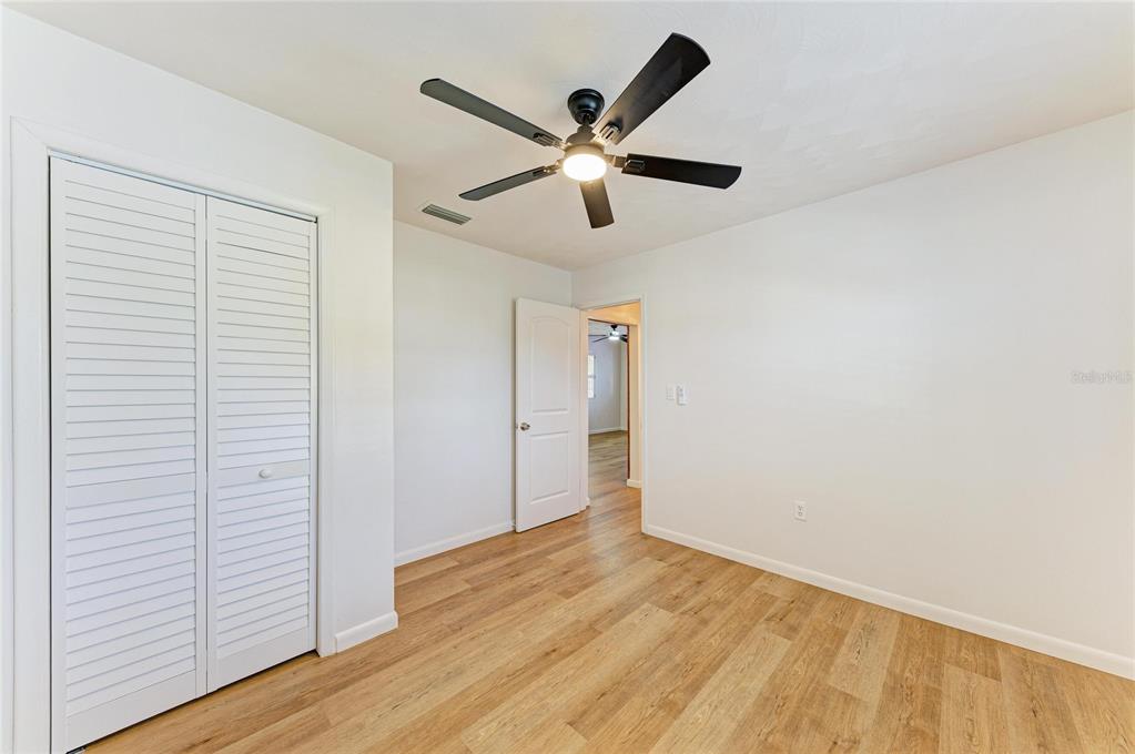 616 Palm Avenue Ellenton, FL 34222 - Photo 22 of 53 a view of an empty room with wooden floor