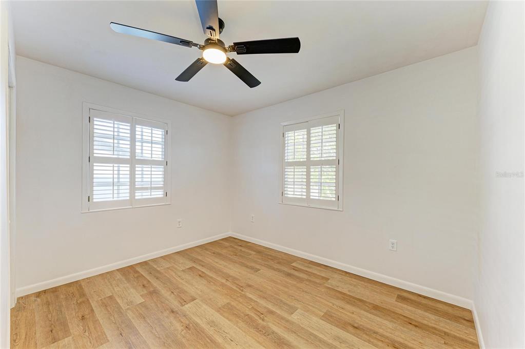 616 Palm Avenue Ellenton, FL 34222 - Photo 23 of 53 a view of empty room with wooden floor and fan