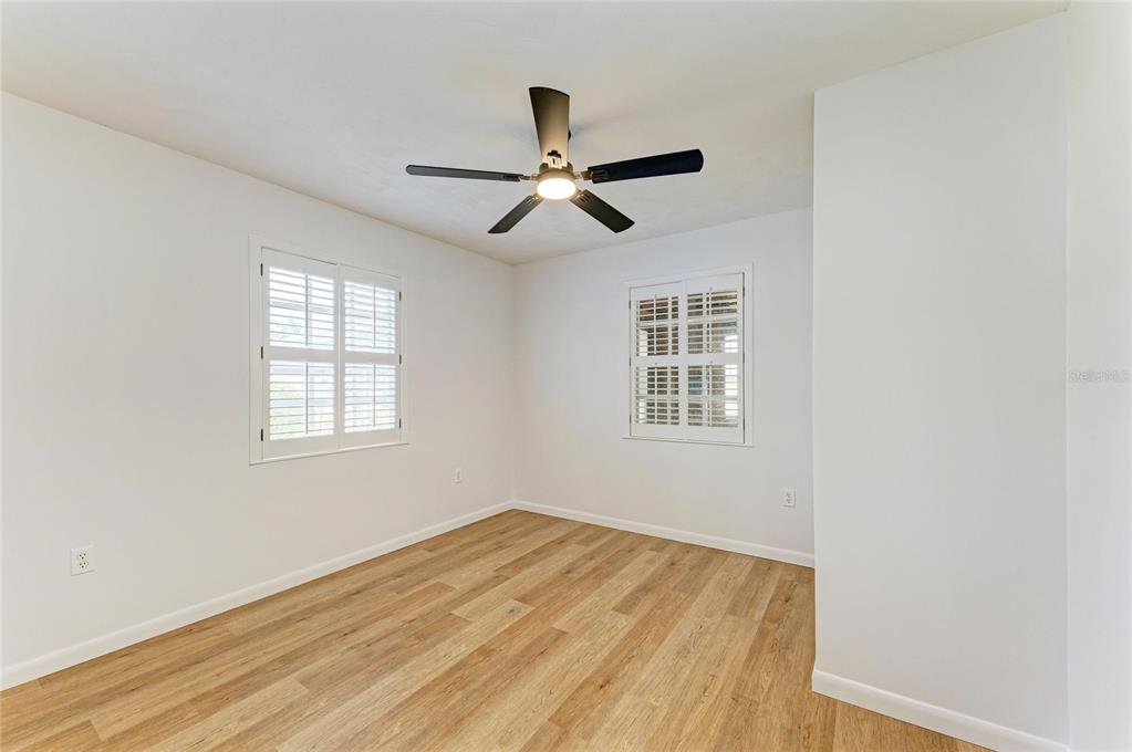 616 Palm Avenue Ellenton, FL 34222 - Photo 24 of 53 a view of empty room with wooden floor and fan