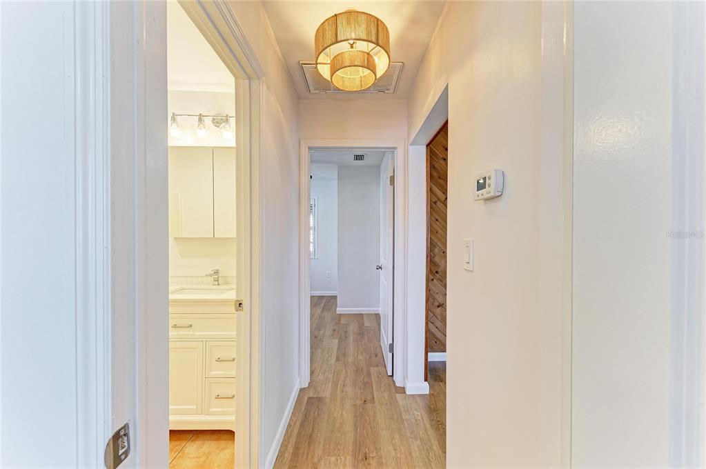 616 Palm Avenue Ellenton, FL 34222 - Photo 25 of 53 a view of a hallway with wooden floor