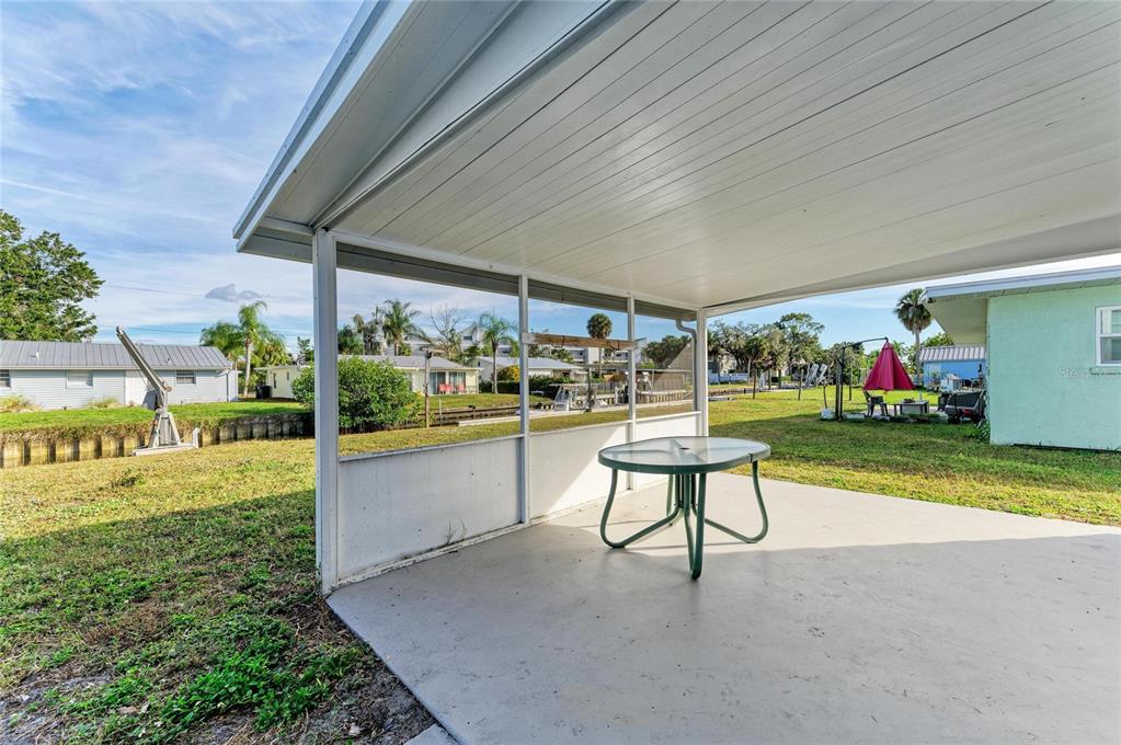 616 Palm Avenue Ellenton, FL 34222 - Photo 47 of 53 a view of a chairs and tables in the patio