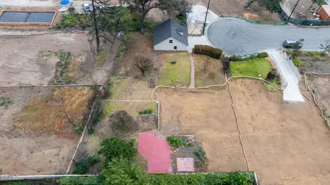 an aerial view of a house with a garden
