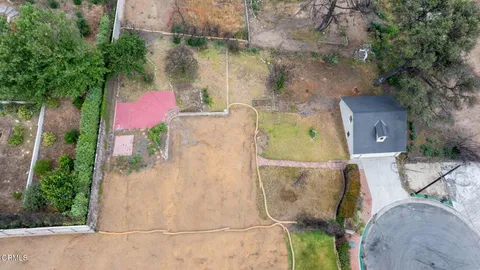 an aerial view of a fireplace with a small yard