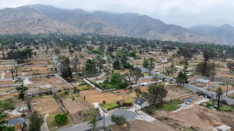 an aerial view of residential house and green space