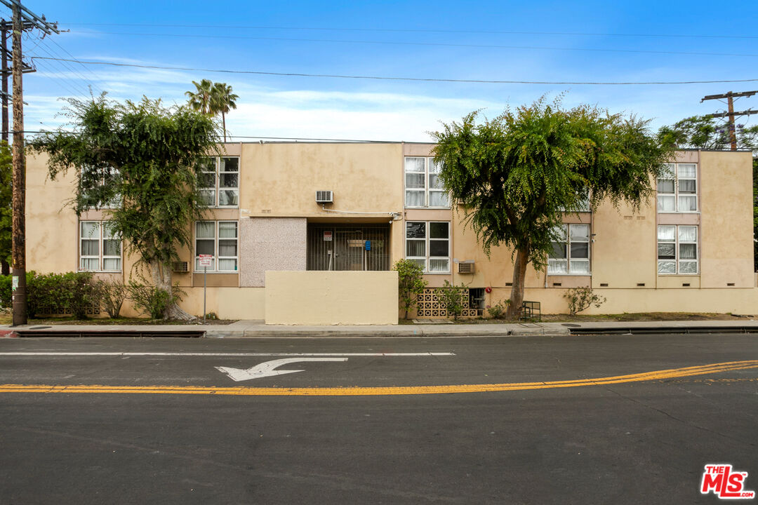 13101 Oxnard Street Van Nuys, CA 91401 - Photo 14 of 14 a view of a building and car parked on the road