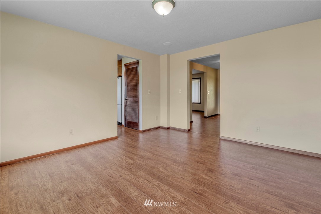 433 Curtis Hill Road Chehalis, WA 98532 - Photo 14 of 22 a view of an empty room with wooden floor and a window