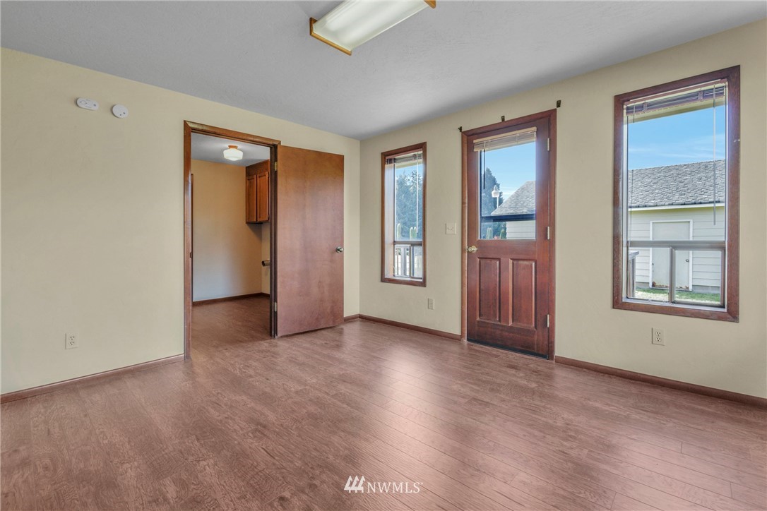 433 Curtis Hill Road Chehalis, WA 98532 - Photo 20 of 22 a view of an empty room with window and wooden floor
