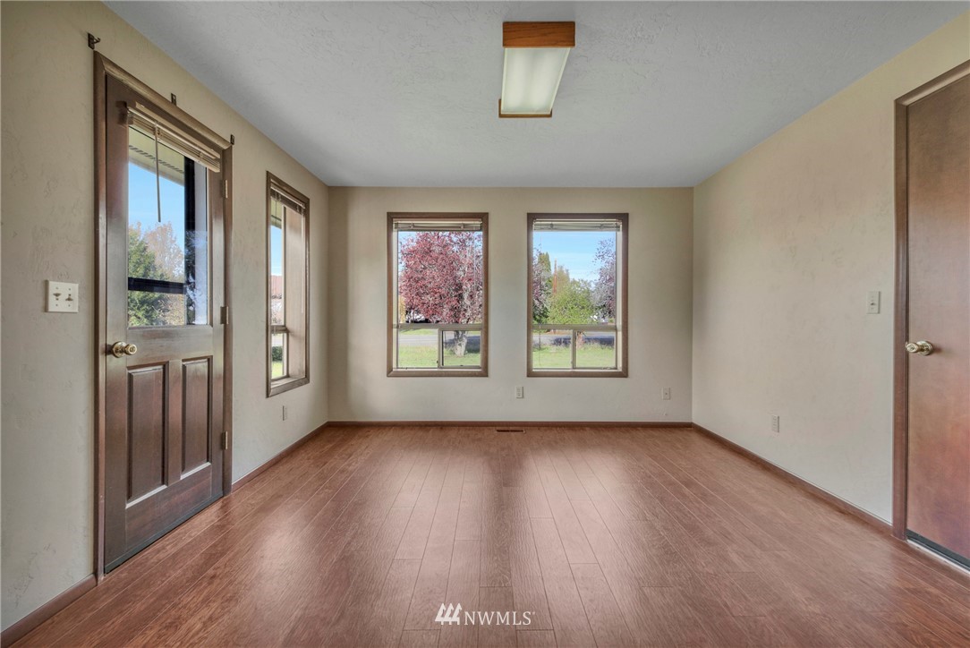 433 Curtis Hill Road Chehalis, WA 98532 - Photo 21 of 22 an empty room with wooden floor and windows