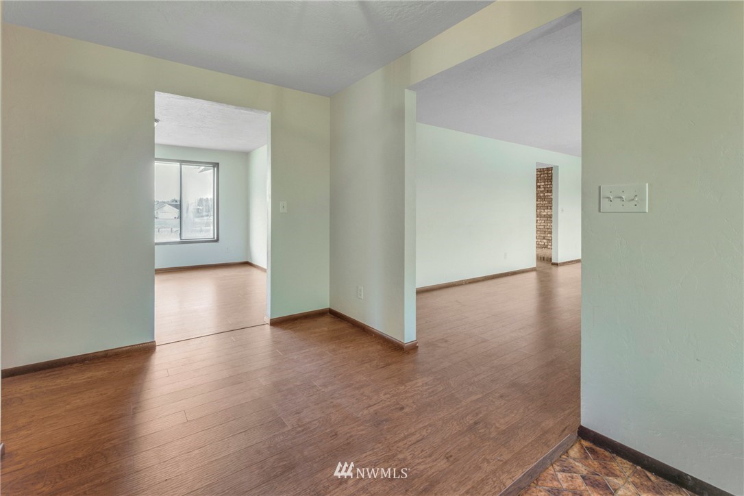433 Curtis Hill Road Chehalis, WA 98532 - Photo 10 of 22 an empty room with wooden floor and windows
