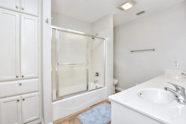 a kitchen with stainless steel appliances granite countertop a sink and cabinets