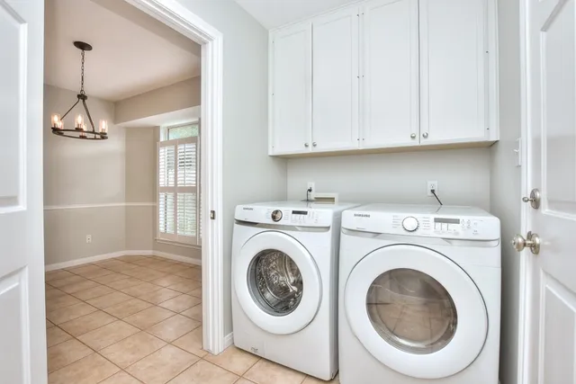 a large kitchen with stainless steel appliances granite countertop a large counter top a stove a sink and a refrigerator