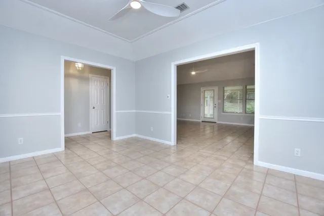 wooden floor in a room with a bathroom