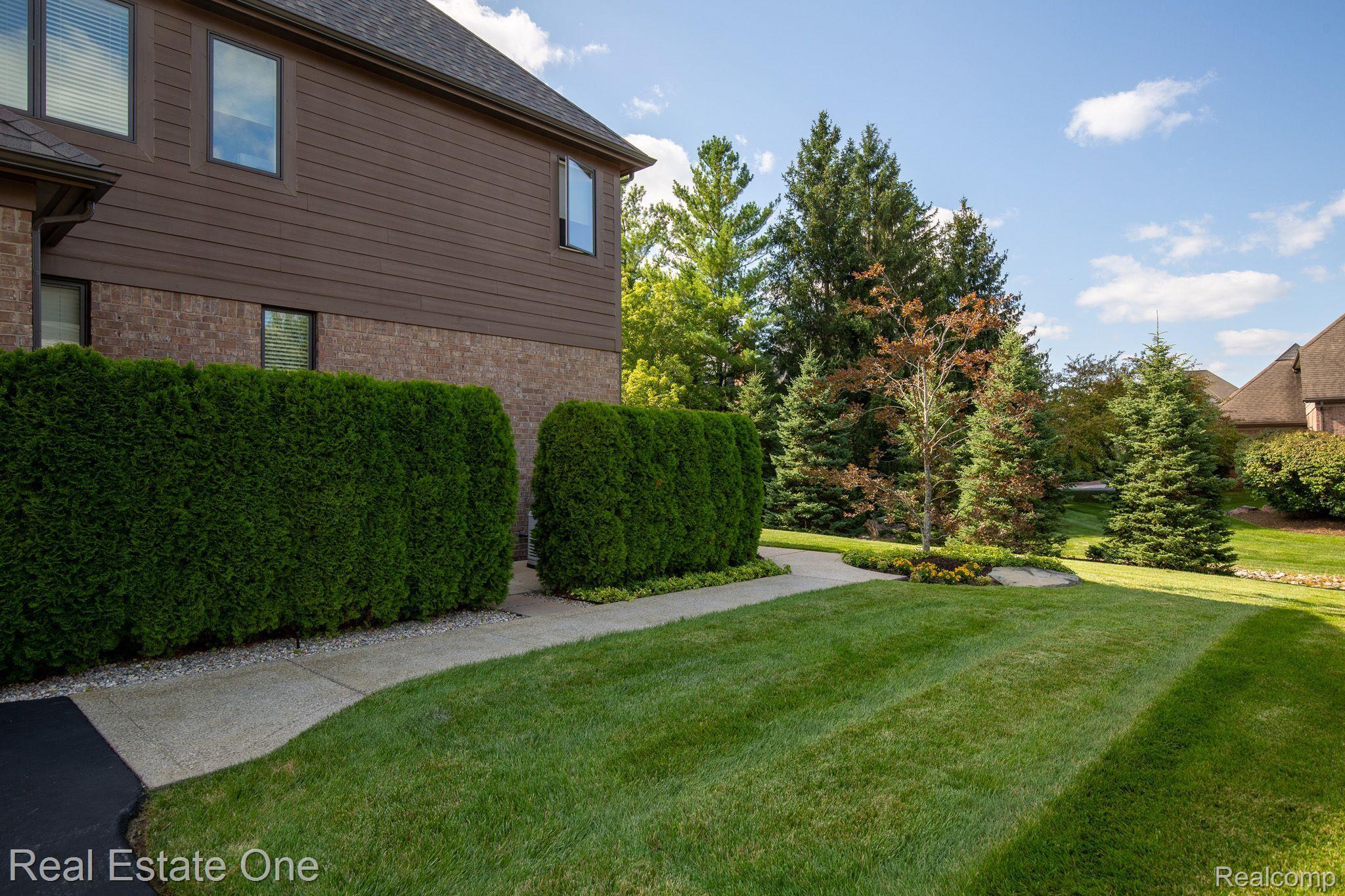3760 Cedar Brook Drive Rochester, MI 48309 - Photo 65 of 76 Aggregate Concrete Walkway to Rear Yard