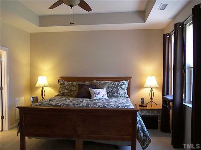 2765 Cashlin Drive Raleigh, NC 27616 - Photo 10 of 25 The master bedroom has a trey ceiling, easily fits a kingsized bed, and faces the fenced backyard.