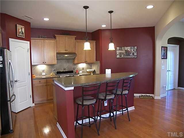 2765 Cashlin Drive Raleigh, NC 27616 - Photo 17 of 25 Notice the tiered kitchen cabinetry and under cabinet lighting.