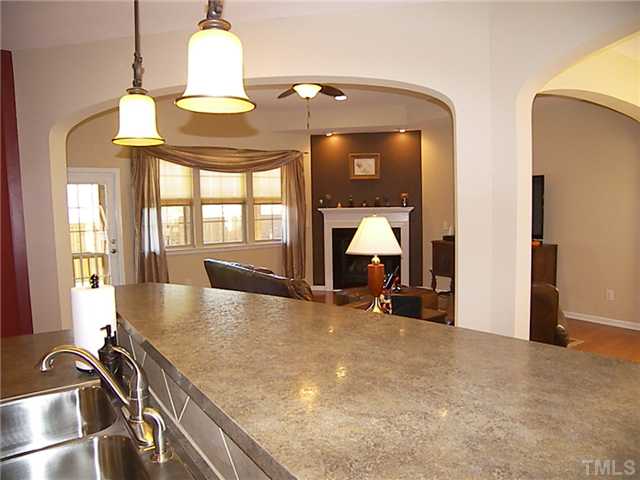 2765 Cashlin Drive Raleigh, NC 27616 - Photo 20 of 25 While you're fixing dinner, kids could be doing homework on the counter or you could turn on the fireplace or tv.