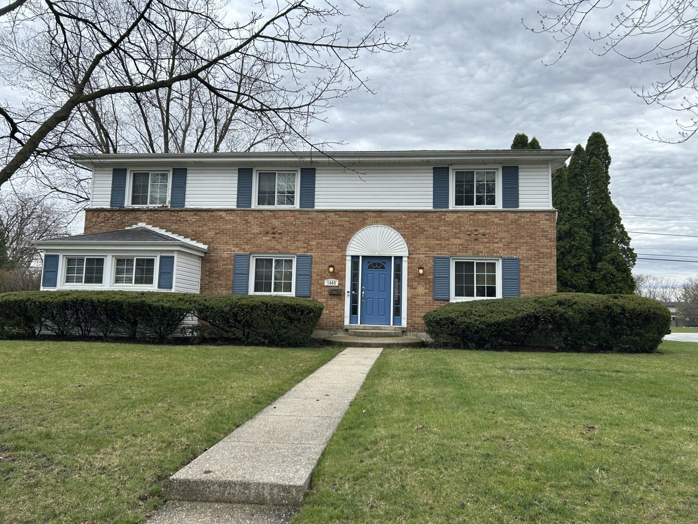 1445 Hackberry Road Deerfield, IL 60015 - Photo 1 of 6 a front view of a house with a yard