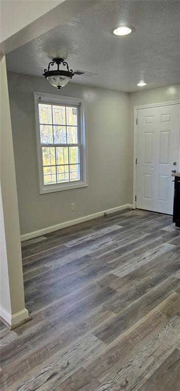 1280 Elizabeth Avenue Southwest Atlanta, GA 30310 - Photo 3 of 9 an empty room with wooden floor and windows