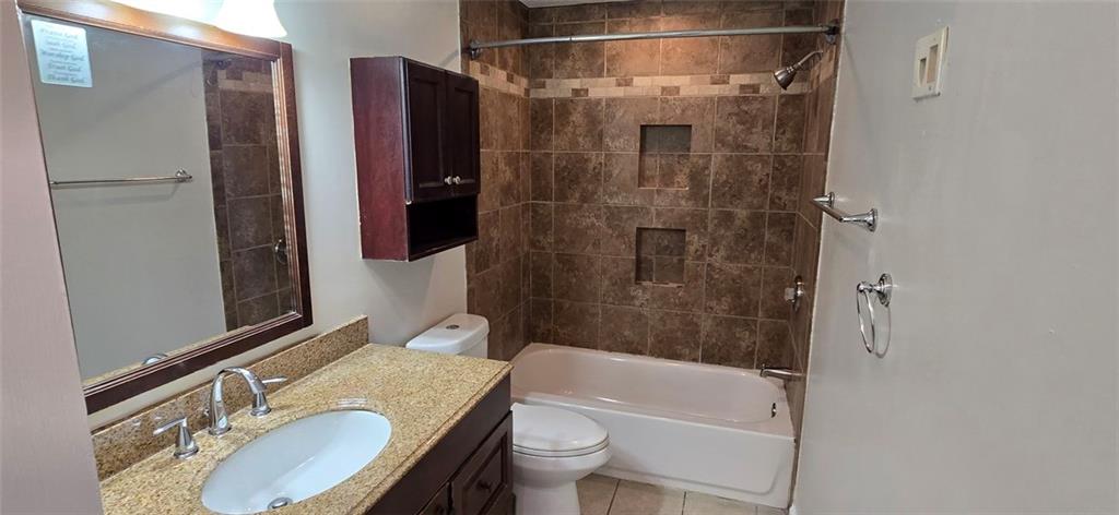 1280 Elizabeth Avenue Southwest Atlanta, GA 30310 - Photo 6 of 9 a bathroom with a granite countertop sink toilet and shower