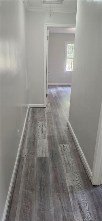 1280 Elizabeth Avenue Southwest Atlanta, GA 30310 - Photo 7 of 9 an empty room with wooden floor and windows