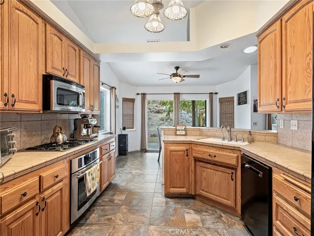 a kitchen with a sink stove and microwave