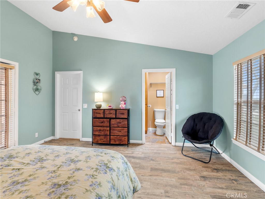 10160 Pineview Road Pinon Hills, CA 92372 - Photo 17 of 46 a bedroom with a bed and a chair