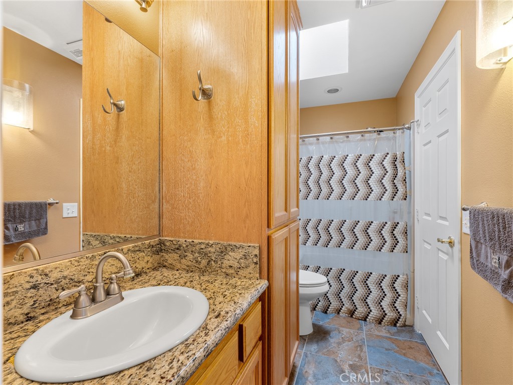 10160 Pineview Road Pinon Hills, CA 92372 - Photo 18 of 46 a bathroom with a sink and a mirror