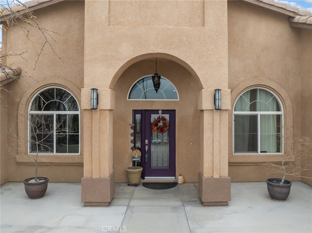 10160 Pineview Road Pinon Hills, CA 92372 - Photo 2 of 46 a front view of a house with entryway